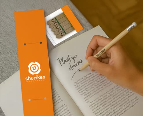 Person using seedsticks pencils - hand writing in book